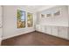 Bright room with built-in cabinets under a large window with wooded views at 739 Marlay Sw Ln, Powder Springs, GA 30127
