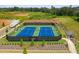Well-maintained tennis courts with viewing areas and nearby pathways, creating a recreational haven at 739 Marlay Sw Ln, Powder Springs, GA 30127