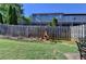 Lush backyard featuring green grass, a privacy fence and a fire pit, perfect for gatherings at 2505 Thackery Ct, Cumming, GA 30041