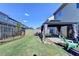 Well-maintained backyard featuring a cozy gazebo, green lawn, and charming wooden fence, perfect for outdoor relaxation at 2505 Thackery Ct, Cumming, GA 30041