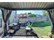 View of the backyard patio including a grill and black mulch area with seating and the wooden fence at 2505 Thackery Ct, Cumming, GA 30041