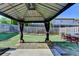 Outdoor living space with a gazebo, patio and green lawn for entertainment at 2505 Thackery Ct, Cumming, GA 30041