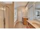 Bathroom with a glass door shower, soaking tub, double sink vanity, and plenty of cabinet space at 2505 Thackery Ct, Cumming, GA 30041