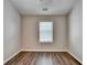 Bedroom featuring a hardwood floors and a window at 2505 Thackery Ct, Cumming, GA 30041