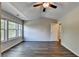 Bright bedroom featuring wood floors, vaulted ceiling, and lots of natural light from windows at 2505 Thackery Ct, Cumming, GA 30041