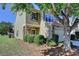 A charming exterior view of this inviting two-story home with lush greenery at 2505 Thackery Ct, Cumming, GA 30041