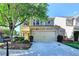 Charming two-story home with stone accents, a two-car garage, and mature trees enhancing curb appeal at 2505 Thackery Ct, Cumming, GA 30041