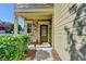 Inviting front porch with stone accents, a stylish front door, and manicured bushes for added curb appeal at 2505 Thackery Ct, Cumming, GA 30041