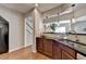 Open concept kitchen featuring breakfast bar looking to the stairway and stainless steel appliances at 2505 Thackery Ct, Cumming, GA 30041