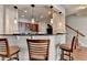 Stylish kitchen bar with pendant lights, granite countertop, and seating for casual dining at 2505 Thackery Ct, Cumming, GA 30041