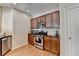 This modern kitchen features stainless steel appliances, wood cabinets, and granite countertops at 2505 Thackery Ct, Cumming, GA 30041