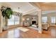 Spacious living room with ample natural light, fireplace, hardwood floors and neutral color palette at 2505 Thackery Ct, Cumming, GA 30041