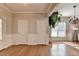 Spacious living room featuring hardwood floors, white trim, and natural light, creating a welcoming atmosphere at 2505 Thackery Ct, Cumming, GA 30041