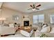Comfortable living room with a fireplace, hardwood floors, and neutral color palette at 2505 Thackery Ct, Cumming, GA 30041
