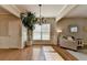 Bright living room showcasing hardwood floors, a large window, and neutral furniture at 2505 Thackery Ct, Cumming, GA 30041