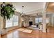 Open concept living room showcases hardwood floors, a fireplace, and seamless flow to other living spaces at 2505 Thackery Ct, Cumming, GA 30041