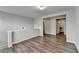Open loft area with hardwood flooring and neutral wall color at 2505 Thackery Ct, Cumming, GA 30041