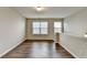 Bright loft featuring wood floors, and natural light pouring through the windows at 2505 Thackery Ct, Cumming, GA 30041
