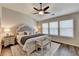 Serene main bedroom with vaulted ceiling, ceiling fan, and large windows offering natural light at 2505 Thackery Ct, Cumming, GA 30041