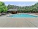 Enjoy the neighborhood pool with covered picnic area and lush green landscaping at 2505 Thackery Ct, Cumming, GA 30041