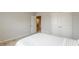 Bright bedroom with a double closet featuring plush carpets and neutral walls at 3868 Sweet Iris Cir, Loganville, GA 30052