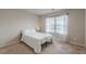 Cozy bedroom featuring a bed next to the window at 3868 Sweet Iris Cir, Loganville, GA 30052