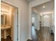 Hallway leading to a powder room and a view of the front entryway at 3868 Sweet Iris Cir, Loganville, GA 30052