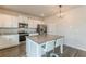 Modern kitchen featuring granite countertops, stainless steel appliances, and an island with seating at 3868 Sweet Iris Cir, Loganville, GA 30052
