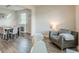 Inviting living room featuring hardwood floors, a modern fireplace, and a cozy seating area, perfect for relaxation at 3868 Sweet Iris Cir, Loganville, GA 30052
