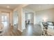 Bright, open living room with hardwood floors, and a view into the dining area, showcasing modern interior design elements at 3868 Sweet Iris Cir, Loganville, GA 30052