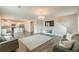 Open-concept living room leading to the kitchen features hardwood flooring and natural light at 3868 Sweet Iris Cir, Loganville, GA 30052