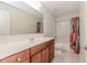 Bathroom featuring a vanity sink, a large mirror, and a shower with a colorful curtain at 674 Chadmon Court Trce, Dacula, GA 30019