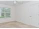 Bright bedroom with a large window for natural light and a white door at 674 Chadmon Court Trce, Dacula, GA 30019