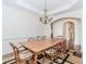 Bright dining room with wooden table, chandelier, and hardwood floors for elegant entertaining at 674 Chadmon Court Trce, Dacula, GA 30019