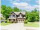 Inviting two-story home with a lush lawn, complemented by an attached two-car garage and plentiful natural light at 674 Chadmon Court Trce, Dacula, GA 30019