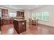 Modern kitchen with stainless appliances, granite island, and wood cabinets at 674 Chadmon Court Trce, Dacula, GA 30019