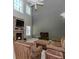 Cozy living room with a stone fireplace, high ceilings, and comfortable furnishings at 674 Chadmon Court Trce, Dacula, GA 30019