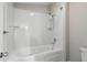 Bathroom with tiled shower-tub combo, white tiling, and large soaking tub at 102 River Oaks Dr, Woodstock, GA 30188