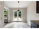 Breakfast nook with french doors leading to the backyard at 102 River Oaks Dr, Woodstock, GA 30188