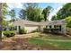 Charming single-story home with a well-maintained lawn, established landscaping and neutral color palette at 102 River Oaks Dr, Woodstock, GA 30188