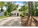 Charming single-story home featuring a well-maintained lawn and mature trees at 102 River Oaks Dr, Woodstock, GA 30188