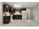 Spacious kitchen featuring granite countertops, tile flooring, and stainless steel appliances at 102 River Oaks Dr, Woodstock, GA 30188