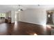 Spacious living room featuring dark wood flooring and a modern ceiling fan at 102 River Oaks Dr, Woodstock, GA 30188