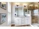 Bright bathroom features a double vanity with granite countertop, tile floor, and glass enclosed shower at 1263 Linden Ne Ct, Atlanta, GA 30329