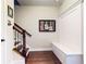 Welcoming entryway features hardwood floors, stairs, and a convenient built-in bench with storage at 1263 Linden Ne Ct, Atlanta, GA 30329