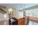 Kitchen island with granite countertop, stainless dishwasher, and hardwood floors at 1263 Linden Ne Ct, Atlanta, GA 30329