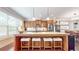 Bright kitchen island with bar stool seating, stainless appliances, and hardwood floors at 1263 Linden Ne Ct, Atlanta, GA 30329