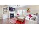 Bright living room features a fireplace, built-in shelving, and access to the outdoors at 1263 Linden Ne Ct, Atlanta, GA 30329