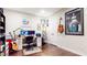 Spacious office with hardwood floors, guitars, and wall art creates an inspiring workspace at 1263 Linden Ne Ct, Atlanta, GA 30329