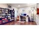Organized home office with wood floors, custom built in shelving, and a large desk at 1263 Linden Ne Ct, Atlanta, GA 30329